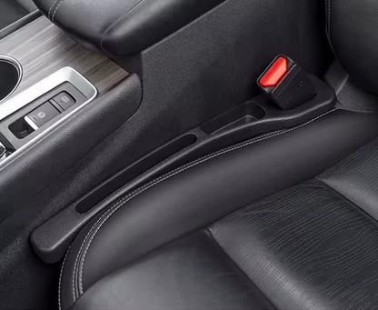 NEUŽKRIS sėdynių tarpų apsauga.