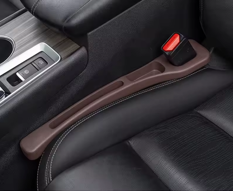 NEUŽKRIS sėdynių tarpų apsauga.