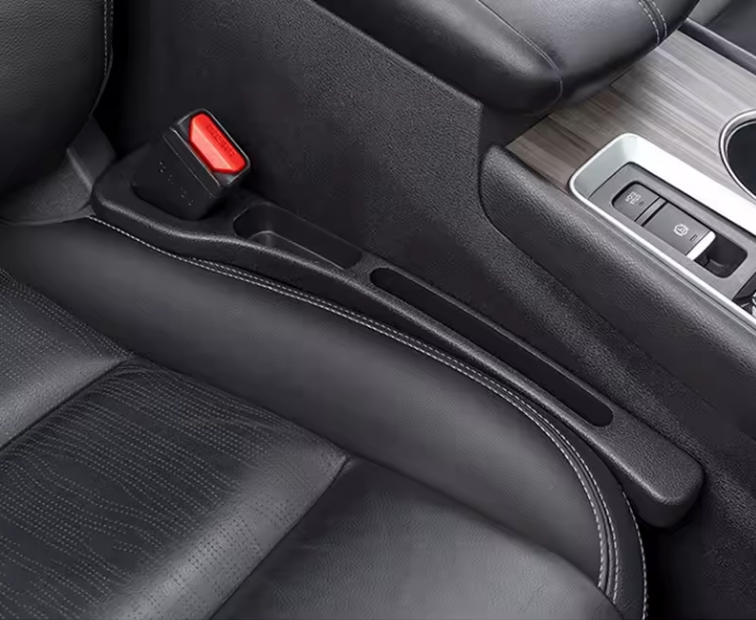 NEUŽKRIS sėdynių tarpų apsauga.