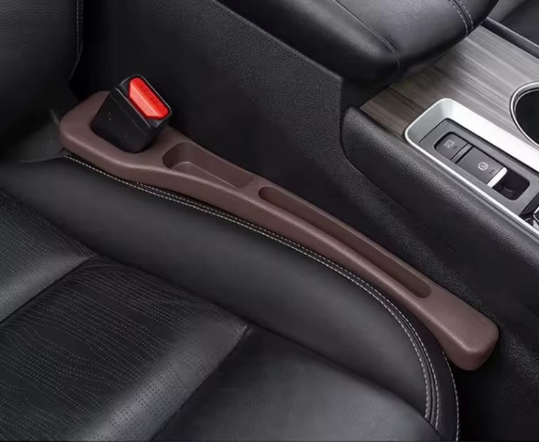 NEUŽKRIS sėdynių tarpų apsauga.